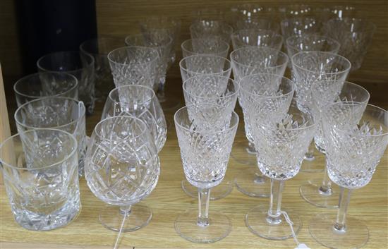 A part suite of Waterford cut glass tableware, two similar Royal Doulton brandy balloons and five whisky tumblers